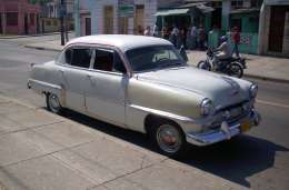 Tourists travel to Cuba to driving a '58 Cadillac