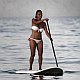 girl on SUP surfing