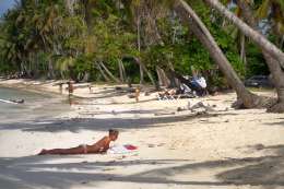 Chica on the beach making vacation in the Dominican Republic